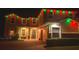 Festive holiday lighting adorns this exterior, adding a joyful touch to the home's curb appeal at 1082 Trappers Trail Loop, Davenport, FL 33896