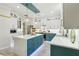 Modern kitchen featuring a center island, stainless steel appliances, and contemporary lighting at 1082 Trappers Trail Loop, Davenport, FL 33896