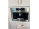 Kitchen features a stainless steel appliance with white cabinets and gold pulls at 1082 Trappers Trail Loop, Davenport, FL 33896