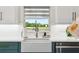 Kitchen features views and a farmhouse sink at 1082 Trappers Trail Loop, Davenport, FL 33896