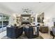 Stylish living room featuring modern furnishings, a sleek fireplace, custom built-in shelving, and contemporary décor at 1082 Trappers Trail Loop, Davenport, FL 33896