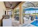 Enclosed patio featuring a dining table, outdoor seating and a grill, perfect for entertaining at 1082 Trappers Trail Loop, Davenport, FL 33896