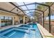 Outdoor living area with a covered patio, heated pool, and jacuzzi perfect for relaxation and entertainment at 1082 Trappers Trail Loop, Davenport, FL 33896