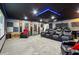 Luxurious theater room with plush seating, accent lighting, and a projector for immersive entertainment at 1082 Trappers Trail Loop, Davenport, FL 33896