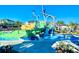 Community water park featuring slides and splash area for Gathering fun at 1082 Trappers Trail Loop, Davenport, FL 33896