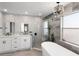 Luxurious bathroom with a soaking tub, walk-in shower, and modern fixtures at 1133 Brandy Lake View Cir, Winter Garden, FL 34787