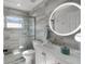 Modern bathroom with stylish gray tiling, glass shower, and sleek vanity for a luxurious feel at 1133 Brandy Lake View Cir, Winter Garden, FL 34787