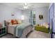 Cozy bedroom featuring a plush bed, soft colors, and a sunny window view at 1133 Brandy Lake View Cir, Winter Garden, FL 34787