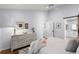 Bright bedroom featuring hardwood floors and a glimpse of the adjacent bathroom at 1133 Brandy Lake View Cir, Winter Garden, FL 34787