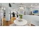 Open-concept dining area with modern furnishings, integrated with the kitchen and living spaces at 1133 Brandy Lake View Cir, Winter Garden, FL 34787