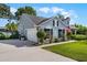 Side view of house with two car garage and pristine landscaping at 1133 Brandy Lake View Cir, Winter Garden, FL 34787