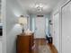 Welcoming foyer with wood floors, fresh paint, and decorative lighting at 1133 Brandy Lake View Cir, Winter Garden, FL 34787
