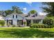 Charming single Gathering home with a lush green lawn and beautiful landscaping at 1133 Brandy Lake View Cir, Winter Garden, FL 34787