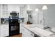 Modern kitchen with stainless steel appliances and a granite countertop island with a sink at 1133 Brandy Lake View Cir, Winter Garden, FL 34787