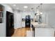 Modern kitchen featuring white cabinets, granite countertops, and stainless steel appliances at 1133 Brandy Lake View Cir, Winter Garden, FL 34787