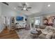 Bright and airy living room with stylish furnishings and sliding door access to the patio at 1133 Brandy Lake View Cir, Winter Garden, FL 34787