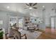 Comfortable living room with modern decor, neutral color palette and backyard views at 1133 Brandy Lake View Cir, Winter Garden, FL 34787