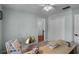Bright office with neutral walls and carpet, with light wood desk and a comfortable chair at 1133 Brandy Lake View Cir, Winter Garden, FL 34787