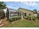 Beautiful backyard features a pool, screened lanai, and lush green landscaping at 12832 Downstream Cir, Orlando, FL 32828