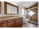 Updated bathroom features modern vanity and tile shower at 12832 Downstream Cir, Orlando, FL 32828