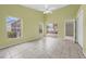 Green Bonus Room with fan and sliding glass door leading to the back yard at 12832 Downstream Cir, Orlando, FL 32828