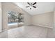 Open Bonus Room with fan and sliding glass door leading to the screened lanai and pool area at 12832 Downstream Cir, Orlando, FL 32828