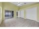 Green Bonus Room with fan and sliding glass door leading to the back yard at 12832 Downstream Cir, Orlando, FL 32828