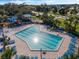Community pool, lounging chairs and clear blue skies at 12832 Downstream Cir, Orlando, FL 32828