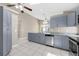 Modern kitchen with stainless steel appliances, granite countertops, and ample storage at 12832 Downstream Cir, Orlando, FL 32828