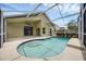 Backyard pool area featuring clear blue water, sunbathing space, and a screened-in lanai at 12832 Downstream Cir, Orlando, FL 32828