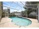 Inviting pool with a blue-tiled edge, surrounded by a screened enclosure at 12832 Downstream Cir, Orlando, FL 32828