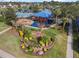 Aerial view of the recreation center featuring playground and manicured greenery at 12832 Downstream Cir, Orlando, FL 32828