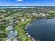 High aerial perspective showcasing a lakeside community, surrounded by nature and offering serene waterfront living at 13120 Zori Ln, Windermere, FL 34786