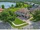 Beautiful aerial view of a spacious two-story home with a three-car garage and brick-paved driveway at 13120 Zori Ln, Windermere, FL 34786