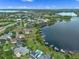 Aerial view highlighting the property lines of a waterfront estate with dock access and lake views at 13120 Zori Ln, Windermere, FL 34786