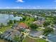 Scenic aerial view showcasing lakefront homes and lush landscaping in a desirable community at 13120 Zori Ln, Windermere, FL 34786