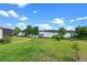 Expansive backyard view of the lake with dock and gazebo at 13120 Zori Ln, Windermere, FL 34786