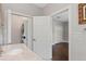 Bathroom featuring a marble vanity, sink, and doorway to the bedroom at 13120 Zori Ln, Windermere, FL 34786