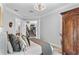 Bright bedroom with neutral colors, a cozy bed, and access to staircase and ensuite bathroom at 13120 Zori Ln, Windermere, FL 34786