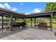 Covered dock featuring a bench and watercraft storage provides a peaceful and functional lakeside retreat at 13120 Zori Ln, Windermere, FL 34786