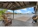 Covered boat dock features seating and a ladder, offering a peaceful spot with scenic lake views at 13120 Zori Ln, Windermere, FL 34786