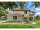 Charming two-story home with well-manicured landscaping and brick walkway leading to the front entrance at 13120 Zori Ln, Windermere, FL 34786