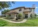Charming two-story home with well-manicured landscaping and brick walkway leading to the front entrance at 13120 Zori Ln, Windermere, FL 34786