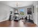 Bright home gym with hardwood floors, exercise equipment, and natural light at 13120 Zori Ln, Windermere, FL 34786