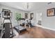Bright home gym with hardwood floors, exercise equipment, and natural light at 13120 Zori Ln, Windermere, FL 34786