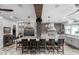 Expansive kitchen with granite counters, brick accents, large island and pendant lighting at 13120 Zori Ln, Windermere, FL 34786