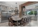 Spacious kitchen with granite counters, brick accents, large island and view of the lake at 13120 Zori Ln, Windermere, FL 34786