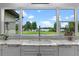 Kitchen sink with granite counters and a view of the lake at 13120 Zori Ln, Windermere, FL 34786