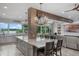 Open floor plan kitchen with a large island, bar stool seating and view of the lake at 13120 Zori Ln, Windermere, FL 34786