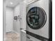 Modern laundry room area with washer/dryer units and neutral color palette at 13120 Zori Ln, Windermere, FL 34786